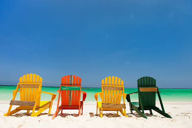 istock Colorful chairs on Caribbean beach 472662220