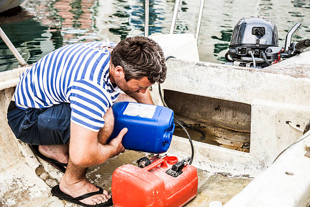 istock Fisherman refill the tank before leaving from the harbor 472665116