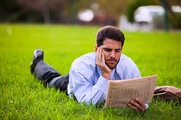 istock Businessman reading the newspaper 472665622