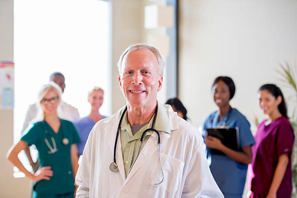 istock Doctor with his Nursing Staff 472677344