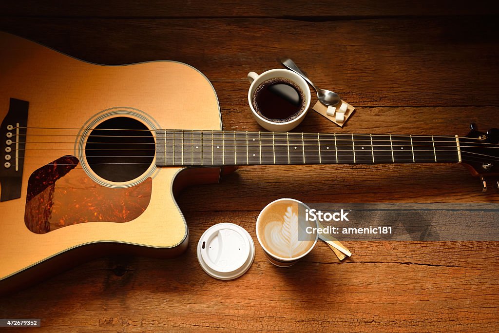 Cups of coffee Cups of coffee and guitar on wooden table Coffee - Drink Stock Photo