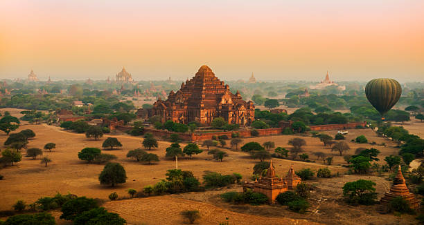 istock Hot Air Balloon Flying Over Bagan Temples at Sunrise 472682036