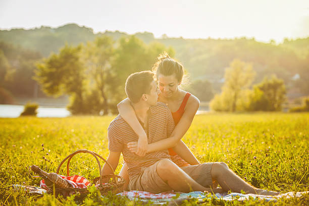 istock Happy young couple on a picnic 472683280