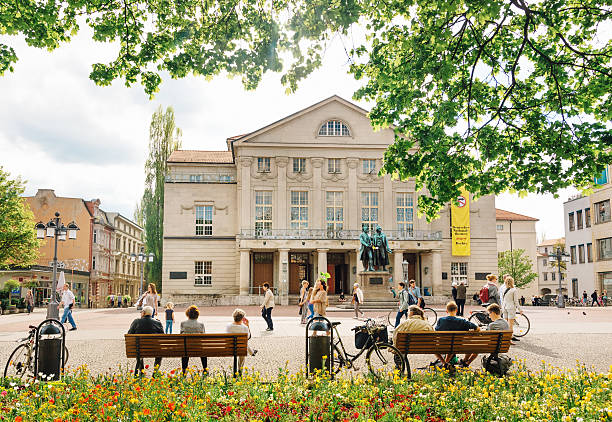 German National Theather in Weimar, Germany Weimar, Germany - May 4, 2015: The famous German National Theater in Weimar (Deutsche Nationaltheater Weimar) withe the monument of Goethe and Schiller created by Ernst Rietschel in 1957. theather stock pictures, royalty-free photos & images