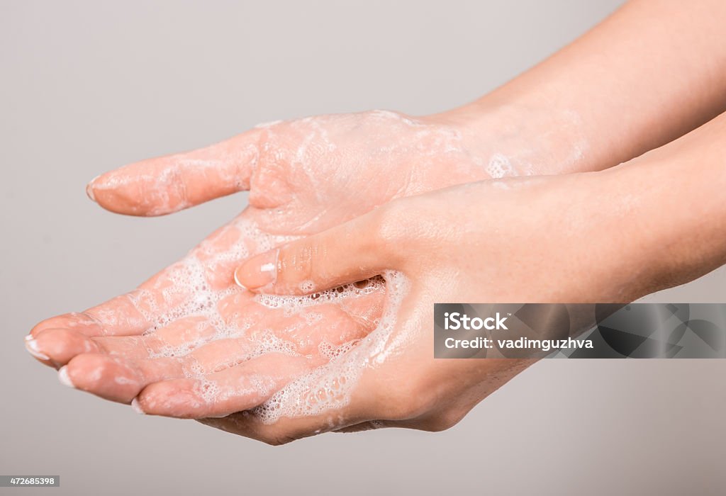 Washing hands A woman washing her hands with a soap suds. 2015 Stock Photo