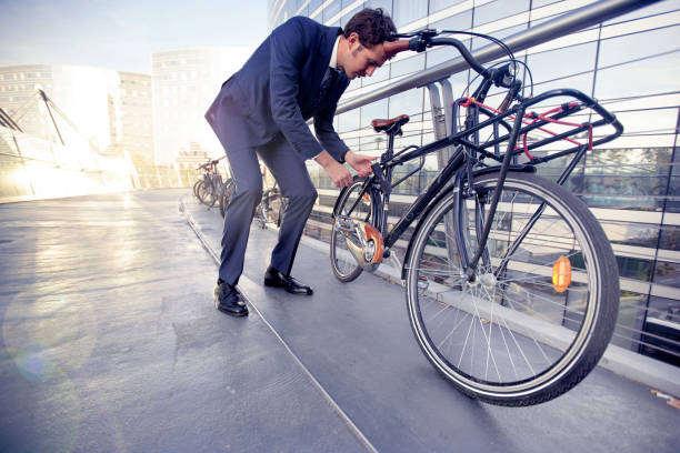 istock Businessman with bike 472685864