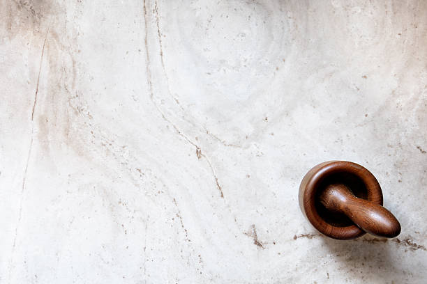 istock Wood mortar on marble slab 472686518