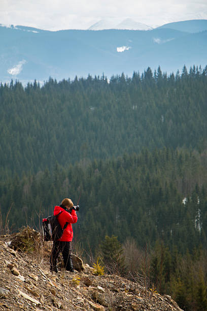 Photographer with mountains background