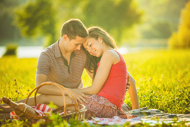 istock Happy young couple on a picnic 472689062