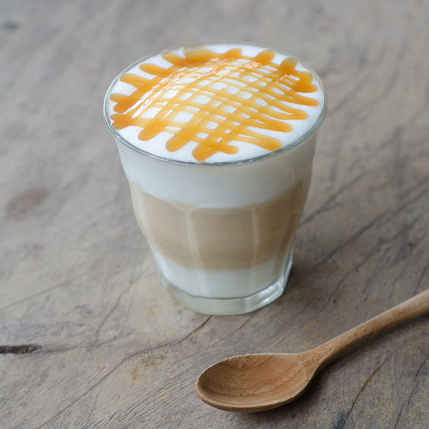 istock hot coffee on wooden table 472689382