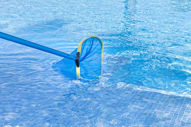 istock Close up of swimming pool being cleaned 472689702