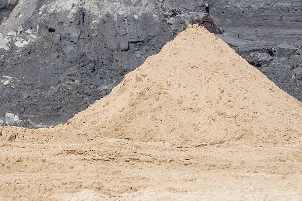 istock pyramid of yellow construction sand 472690166