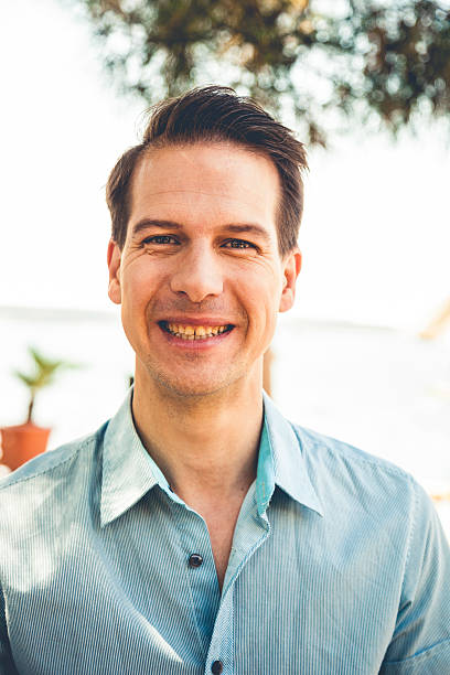 istock Portrait of a man looking at camera 472693314
