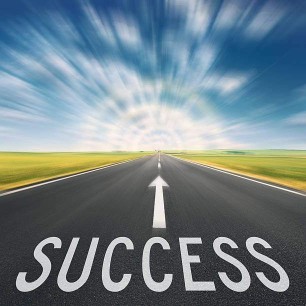 istock Empty road and sign for success in blurred motion 472693428