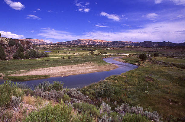 istock Meandering quiet river through green pastures near Bryce Canyon Utah 472693480