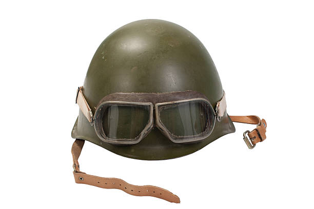 istock army helmet with goggles isolated on white 472693606