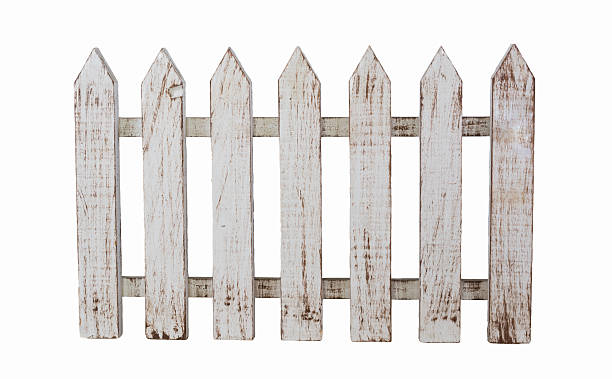 Isolated white wooden fence White picket fence with a rustic vintage paint isolated on white. picket fence stock pictures, royalty-free photos & images