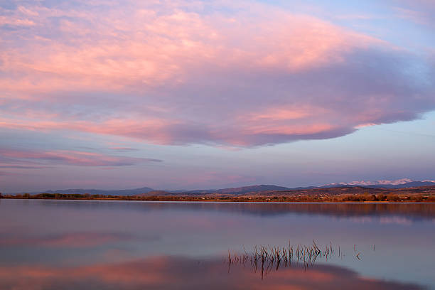 istock Sunrise Clouds over a Colorado Lake 472696136