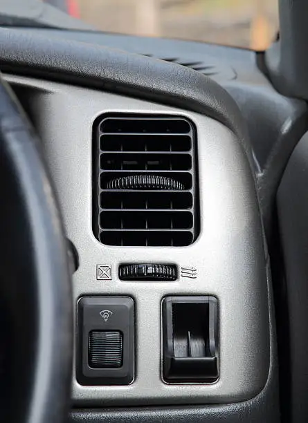 Photo of air condition vent on console in the car