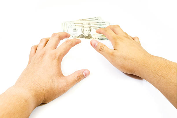 istock Dollars money in hand on white background 472699326