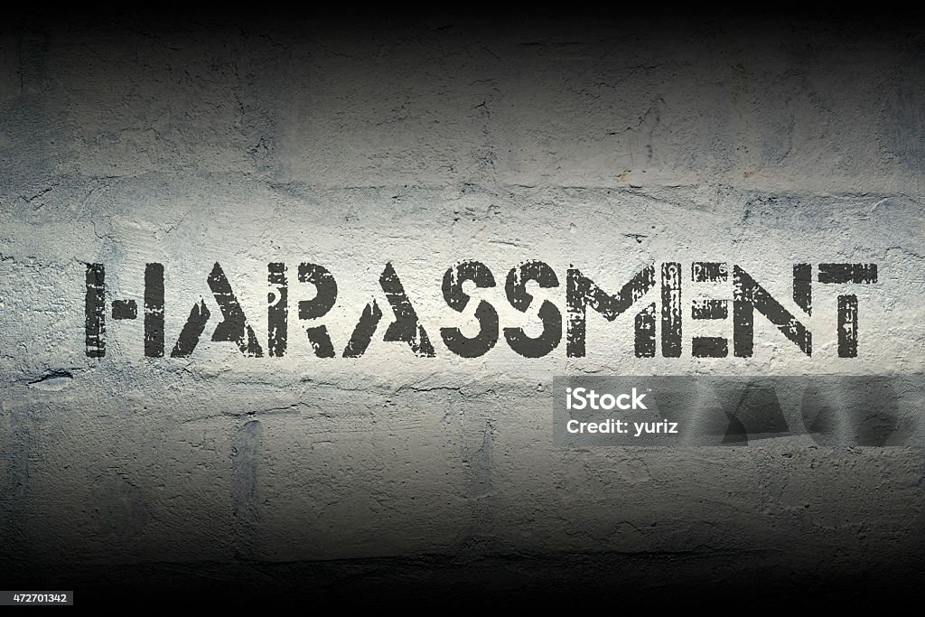 harassment harassment stencil print on the grunge white brick wall 2015 Stock Photo