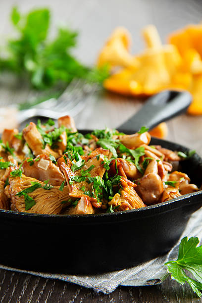 istock Fried chanterelle mushrooms in a creamy sauce 472701540
