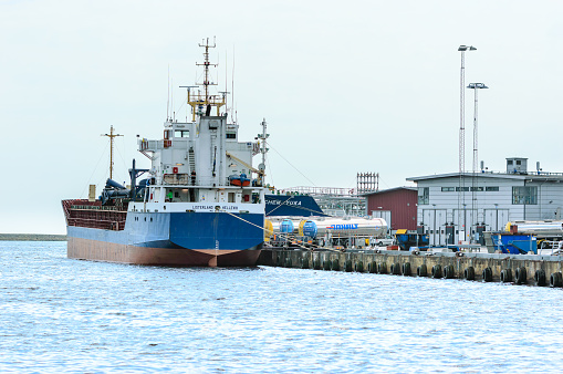 Karlshamn, Sweden - May 06, 2015: M/S Listerland at the docks in Karlshamn. General cargo ship former known as Pioneer. Stern and side view.