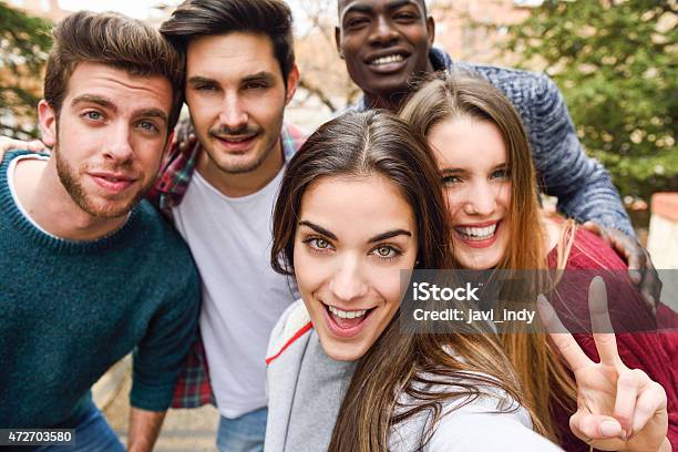 Group Of Friends Having Fun Together Outdoors Stock Photo - Download Image Now - Fun, University, University Student