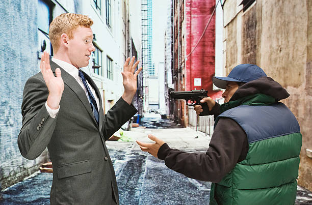 istock Robber robbing man in the suit 472703900