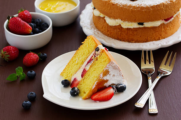 istock Genoise (cake) with cream, berries and lemon cream. 472704004