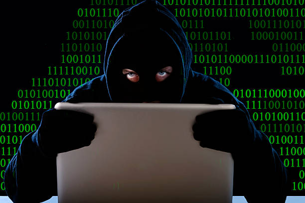 istock digital criminal hacker with computer lock in cyber crime concept 472704264