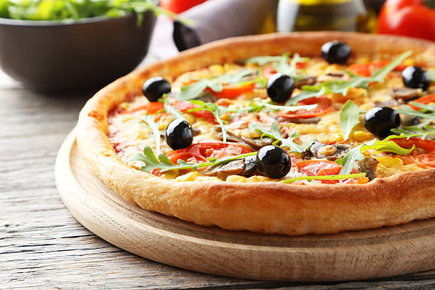 istock Fresh tasty pizza on grey wooden background 472704984