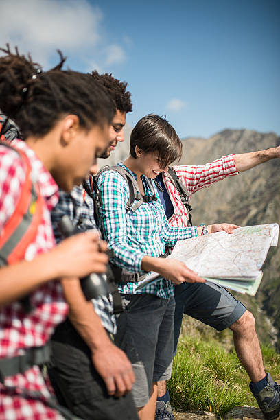 istock Hiking and Reading a map on the mountain 472705194