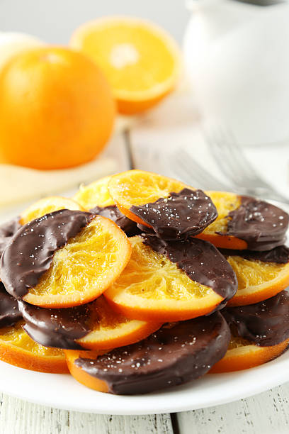 istock Delicious slices of orange coated chocolate 472705682