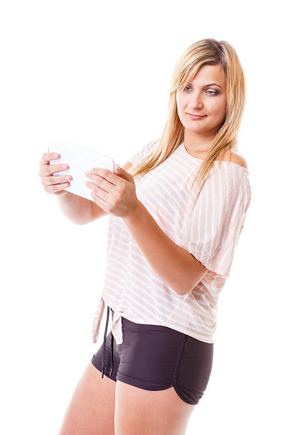 istock Young woman with tablet isolated 472705888