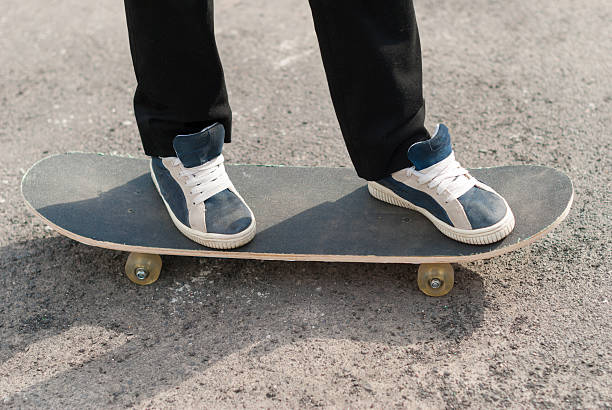 istock Skateboarder feet in sneakers on a skateboard. 472707020