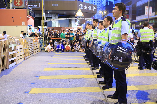 Hong Kong, Сhina - October 17, 2014: police against protesters,after riot police fire tear shell to the peaceful protesters on 28 sept, protester increase