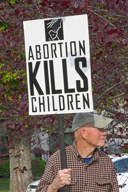 Male Abortion Protester Holds Sign stock photo