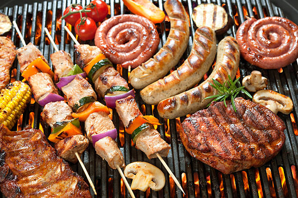 istock Various cooking meats on a flame grill 472711058