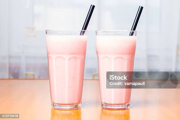 Two Strawberry Smoothies Stock Photo - Download Image Now - Drinking Glass, Milkshake, Smoothie