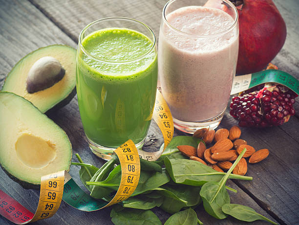 istock two fresh blended fruit smoothies made with avocado and pomegranate 472715068