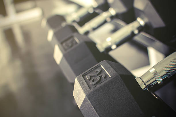 istock Rows of dumbbells on a rack 472715282