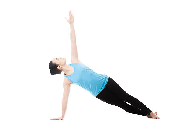 istock Yogi female in yoga Side Plank Pose 472716192