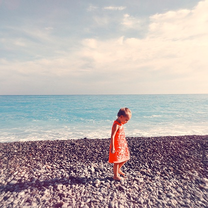 Photo of a little girl at the seashore