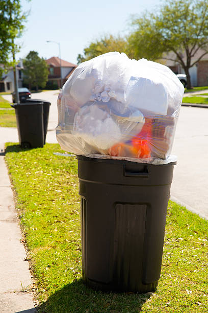 istock Trash bin dustbin full of garbage on street lawn 472718070