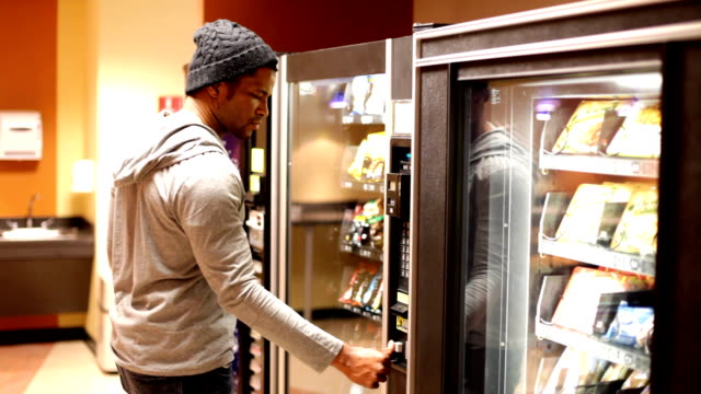 Man getting upset at Vending Machine