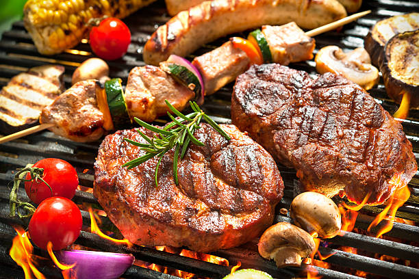 Grill Assorted delicious grilled meat with vegetable over the coals on a barbecue grilled photos stock pictures, royalty-free photos & images