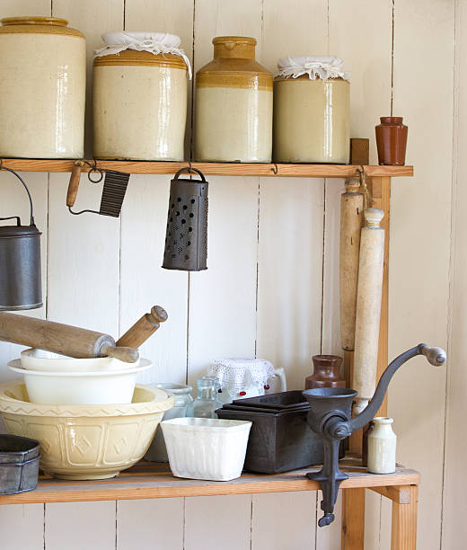 istock Vintage kitchen with various household items on pine shelf 472719598