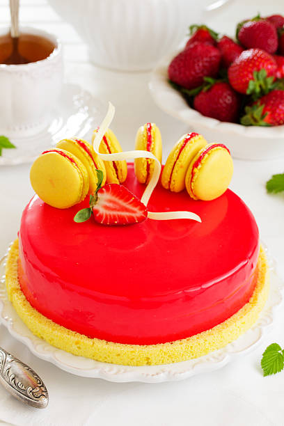 istock Lemon-strawberry cake with makarons. 472719784