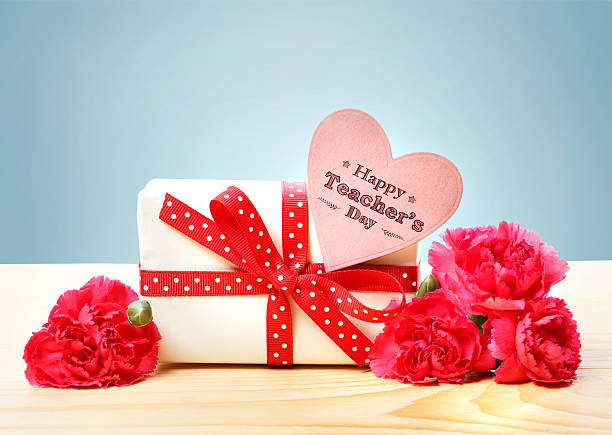 istock Happy Teachers Day message with gift box 472720072